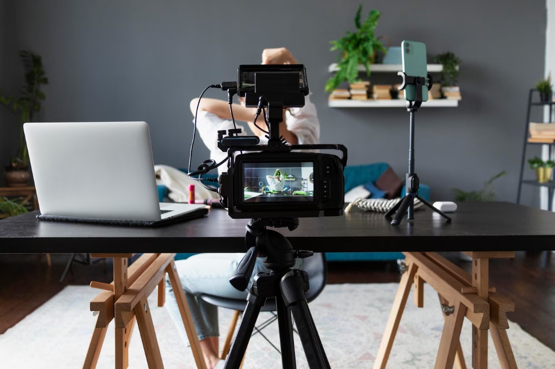 8 Steps to Build a Video Marketing Strategy (+ 6 Extra Tips) 5 Focus on a professional camera recording a vlog