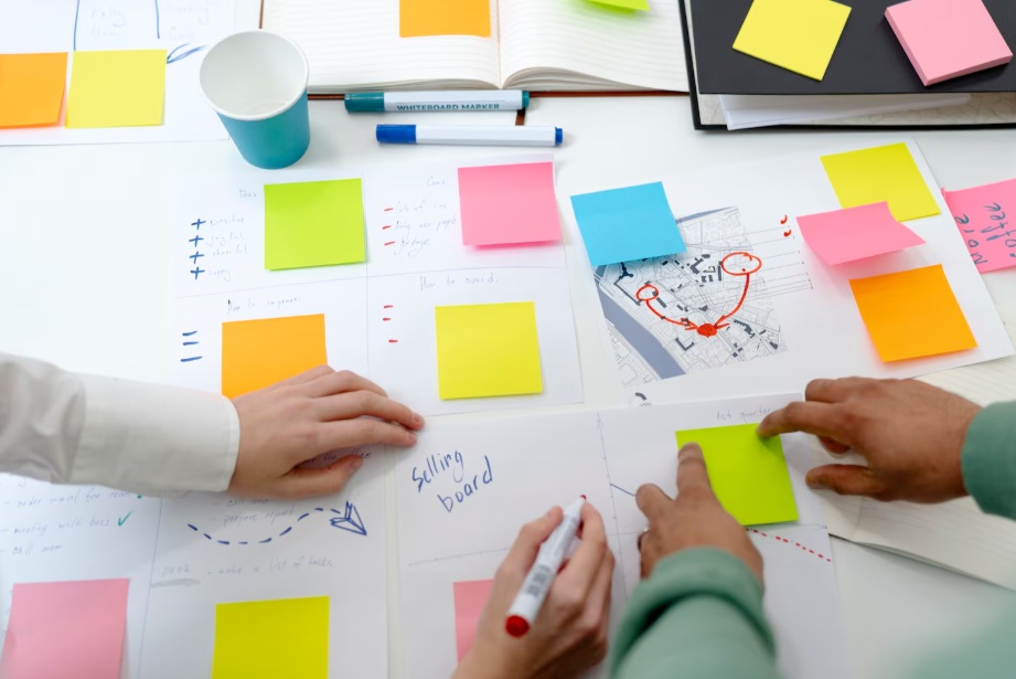High angle of people working on post-its