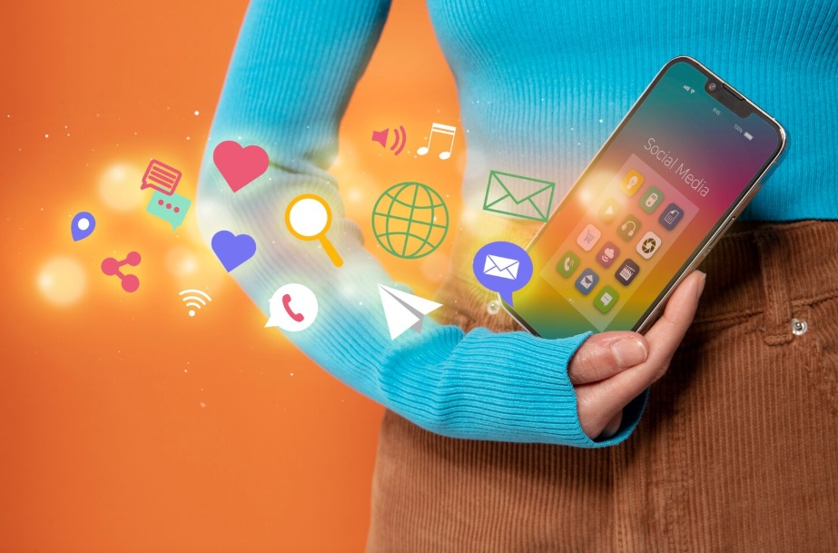 Focus on a smartphone surrounded by social media 3D icons