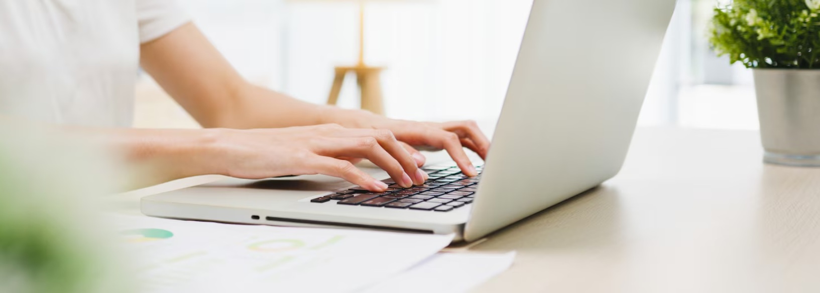 Young copywriter testing SEO techniques on his laptop