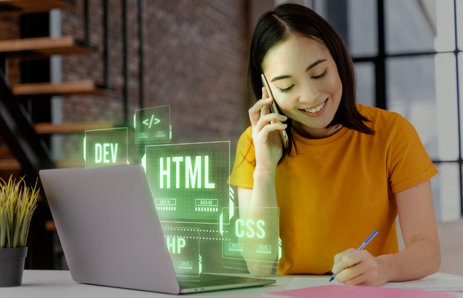 Asian woman working next to her laptop