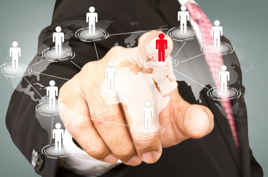 How to Outsource SEO Services: Complete Guide to Get Started 2 Finger of a businessman pressing a red human icon on a connected map